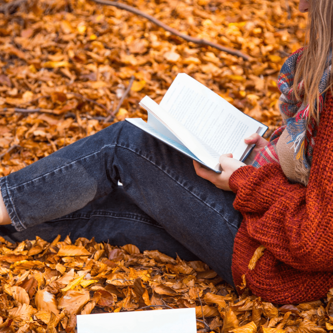 reading in autumn. reading outside on autumn leaves. fall bucket list. autumn bucket list. things do in fall. things to do this fall. things to do in autumn. autumn activities. fall activities. fall ideas. autumn ideas. fall to do list. autumn to do list. activities in fall