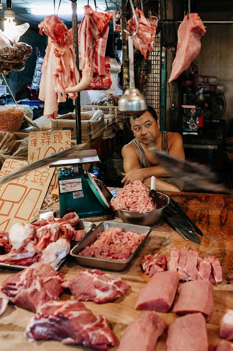 Taipei Eats food tour - man selling meat at the market